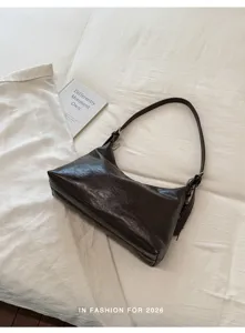 Dark brown faux leather hobo shoulder bag minimalist chic dumpling bag for autumn commuting.