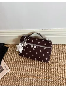 Vintage brown polka dot vanity handbag with top handle and star charm for women daily commute.