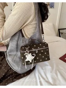 Vintage polka dot handbag for women, chic top handle shoulder bag with cute star charm and zipper.