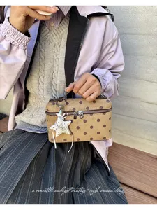 Vintage sweet polka dot handbag for women, chic commuting shoulder and crossbody bag.