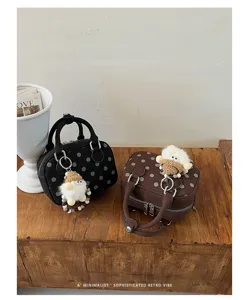 Retro polka dot suede bowling handbag, chic shoulder crossbody bag for daily commute fashion.