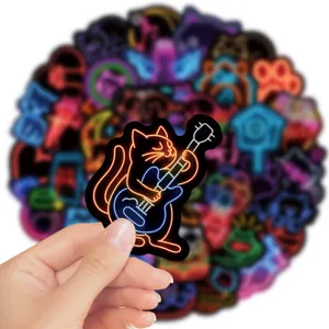 Close-up detail of a glowing neon cat playing guitar sticker, ideal for journaling and laptop decor.