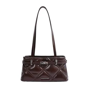 Dark brown quilted shoulder bag detail, elegant metal turn-lock closure and slim double straps.