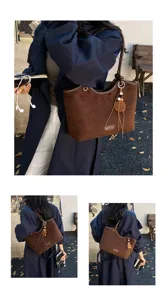 Vintage brown suede tote bag for women, stylish shoulder bag with elegant charm pendant.
