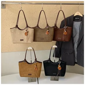 Women retro suede tote bag, stylish shoulder bag with decorative tassel, multi-color variant.