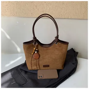 Retro brown suede tote bag with double handles and wooden bead pendant for women daily use.
