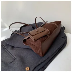 French retro brown suede women shoulder bag, chic small crossbody bag with front pocket design.
