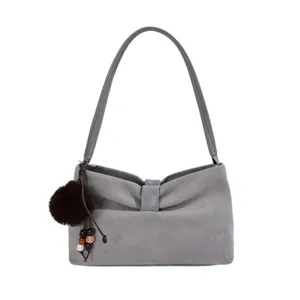 Grey suede shoulder bag with bow detail and fluffy pom-pom pendant for women stylish daily use