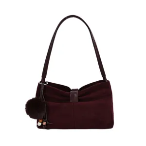 Burgundy suede shoulder bag with chic pom-pom charm, stylish everyday commute handbag.