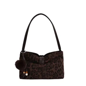 Brown leopard print suede shoulder bag with chic bow detail and cute furry pom pom charm.