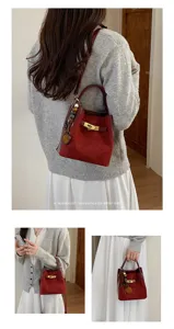 Detailed views of the retro red bucket bag, showcasing elegant lock closure and daily style.