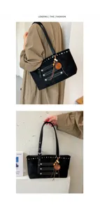 Black suede tote bag detail, featuring metal rivets, wooden pendant, and casual style.