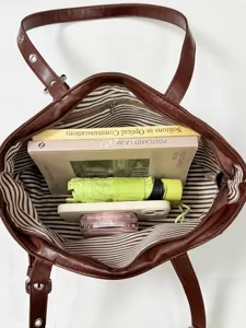 Vintage large capacity women commuting tote bag detail showing spacious striped interior storage.