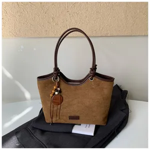 Retro brown suede tote bag for women, stylish shoulder bag with chic wooden bead charm.