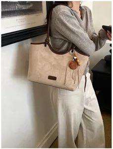 Vintage suede tote bag for women, stylish contrast color shoulder bag with chic charm.