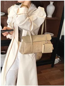 Detailed view of french retro women underarm shoulder bag with small pouch and chic beige tone.