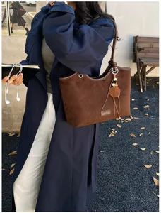 Stylish retro brown suede tote bag for women, chic bucket shoulder bag with chic charms.