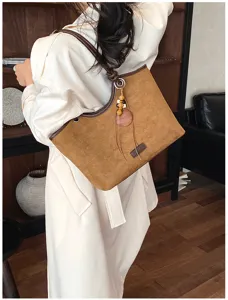 Retro brown suede shoulder tote bag detail view, chic casual daily crossbody design style.