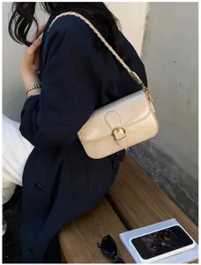 Minimalistische Damen-Umhängetasche mit schickem geflochtenem Riemen und eleganter Schnalle.