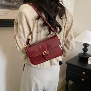 Elegante weinrote Retro Damen Umhängetasche mit geflochtenem Riemen und Metallschließe