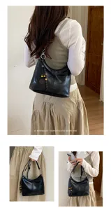 Detail views of a minimalist black hobo shoulder bag, casual retro aesthetic and daily style.