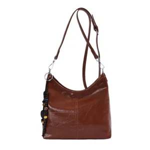 Brown leather shoulder bag for women, stylish hobo dumpling bag with strap and bead charm.
