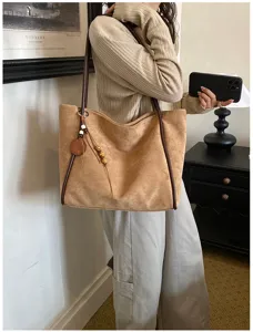 Retro commuter large capacity suede shoulder bag, stylish tote bag detail view for daily wear.