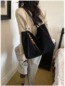 Casual large capacity black shoulder tote bag for women commuting, retro style detail view.