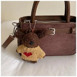 Brown plush bear pendant handbag, vintage suede commuter shoulder crossbody bag for women.
