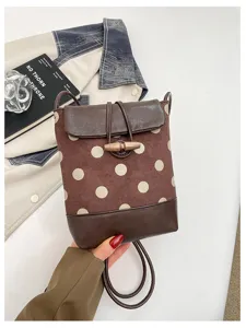 Vintage brown polka dot mini backpack stylish shoulder bag with cute wooden toggle closure.
