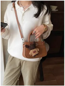 Stylish women's matte shoulder crossbody bag with cute bear pendant for daily commuting.