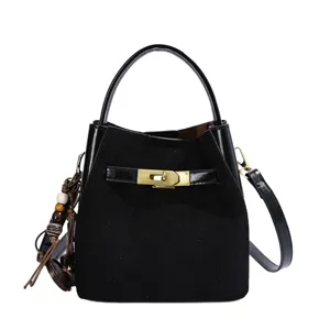 Black suede patchwork bucket bag with metal lock, chic shoulder and crossbody daily bag.