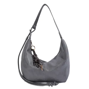 Detailed view of grey PU leather hobo shoulder bag with stylish woven charm and strap.