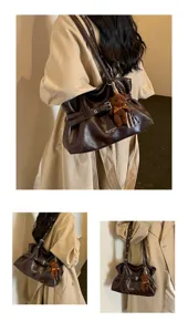 Dark brown slouchy shoulder bag detail showing premium leather texture and cute bear pendant.