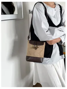 Chic stylish contrast color shoulder bag with suede texture and toggle closure for women.