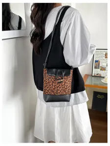 Stylish leopard print bucket bag with crossbody strap and cute toggle closure for women.