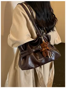 Stylish minimalist women shoulder tote bag with cute bear pendant, autumn commuter brown PU bag.
