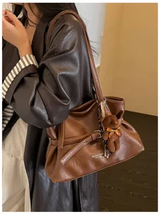 Stylish brown leather tote bag for women, chic shoulder bag with cute bear pendant for daily.