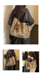Detail shot of retro leopard print tote bag with cute bear pendant, showing large capacity and style.