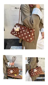 Brown polka dot shoulder bag with cute bear pendant, stylish casual tote for women.
