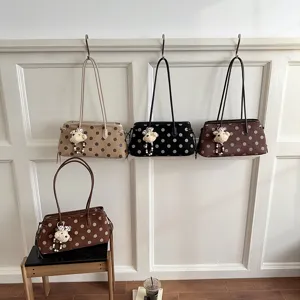 Stylish polka dot shoulder bag with cute bear pendant, large capacity tote bag for daily use.
