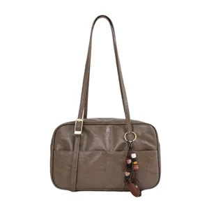 2026 autumn new vintage women shoulder bag, brown underarm bag with pendant and large capacity.