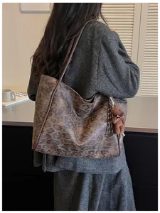 Retro leopard print shoulder bag with cute bear pendant, large capacity casual tote for daily use.