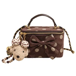 Brown polka dot vanity box bag with cute puppy plush charm and chain strap for women.