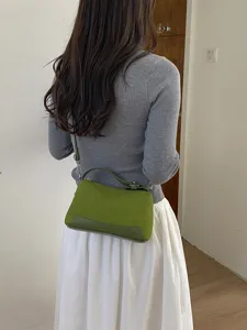 Chic green shoulder bag for women, versatile top handle handbag for daily commute and casual style.