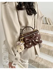 Brown polka dot vanity handbag for women, chic bow shoulder chain bag with cute puppy pendant.