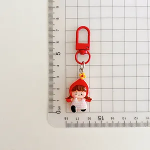 Cute cartoon girl keychain, red hat pink dress bag charm, student schoolbag pendant gift.