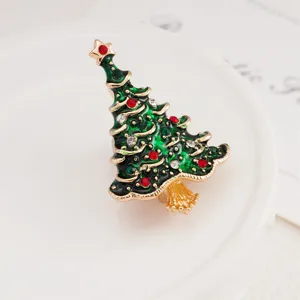 Exquisite Christmas tree brooch with green enamel and sparkling rhinestones for holiday parties.