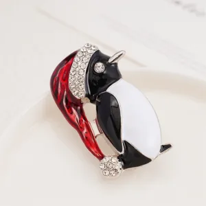 Closeup of the exquisite Christmas penguin brooch with sparkling rhinestones and enamel.