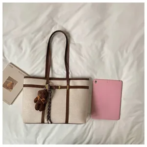 Large capacity canvas tote bag with brown leather trim, retro commuting shoulder bag for women.